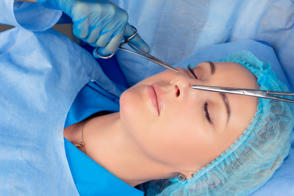 woman getting rhinoplasty surgery